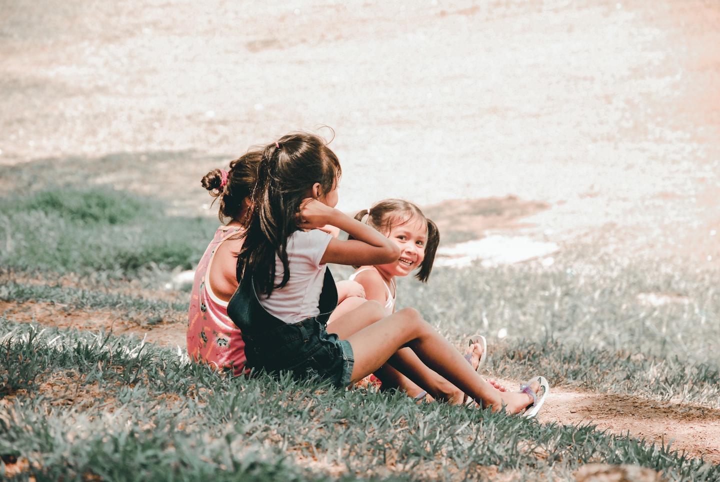 Kids sitting in the grass